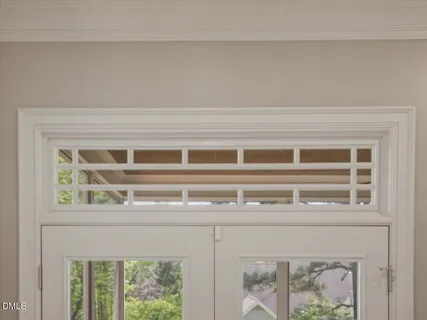 a bathroom with a sink a toilet a mirror and shower
