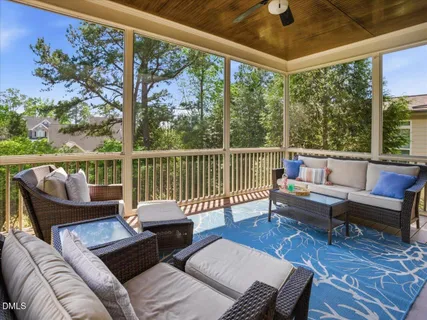 a living room with furniture and a table