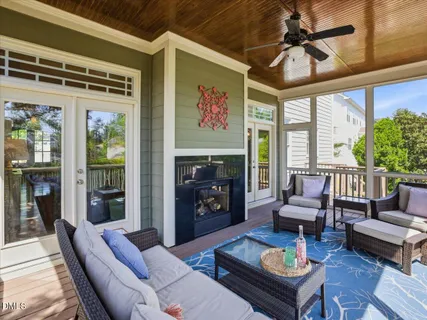 a bathroom with a sink and a stove with wooden floor