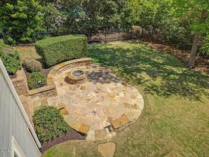a bedroom with a bed a table and bookshelf