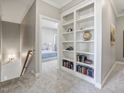 a living room with furniture and a lamp