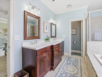 a kitchen with stainless steel appliances granite countertop wooden cabinets a stove top oven a sink and dishwasher