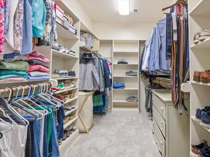 a bathroom with a sink a toilet and shower curtain