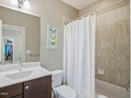 a front view of a house with yard and tress