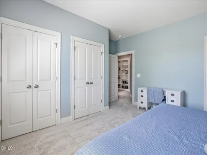 an aerial view of a houses with city view