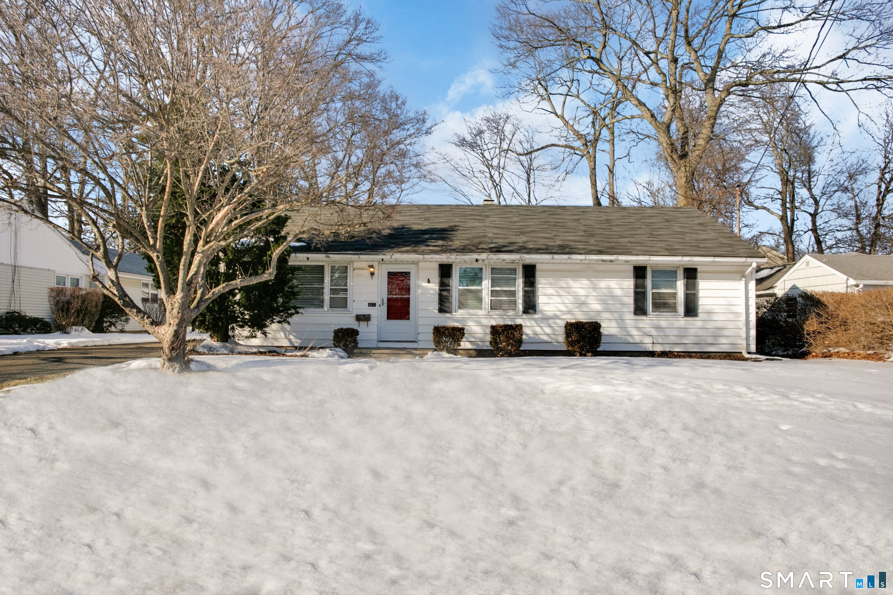 3432 Old Town Road Bridgeport, CT 06606 - Photo 1 of 27 a front view of a house with a yard covered in snow