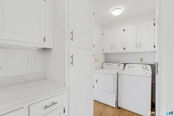 a view of storage and utility room with washer and dryer