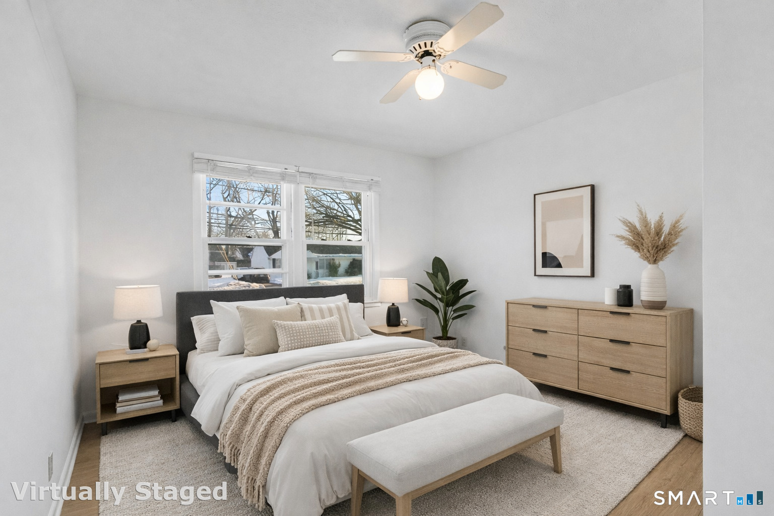 3432 Old Town Road Bridgeport, CT 06606 - Photo 14 of 27 a bedroom with a bed and a chandelier