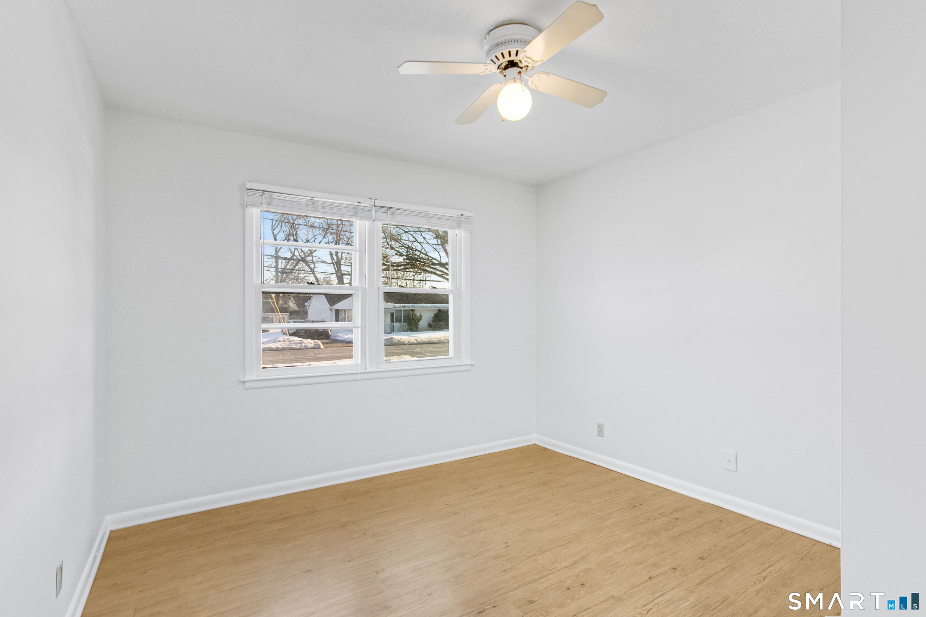 3432 Old Town Road Bridgeport, CT 06606 - Photo 15 of 27 an empty room with windows and fan