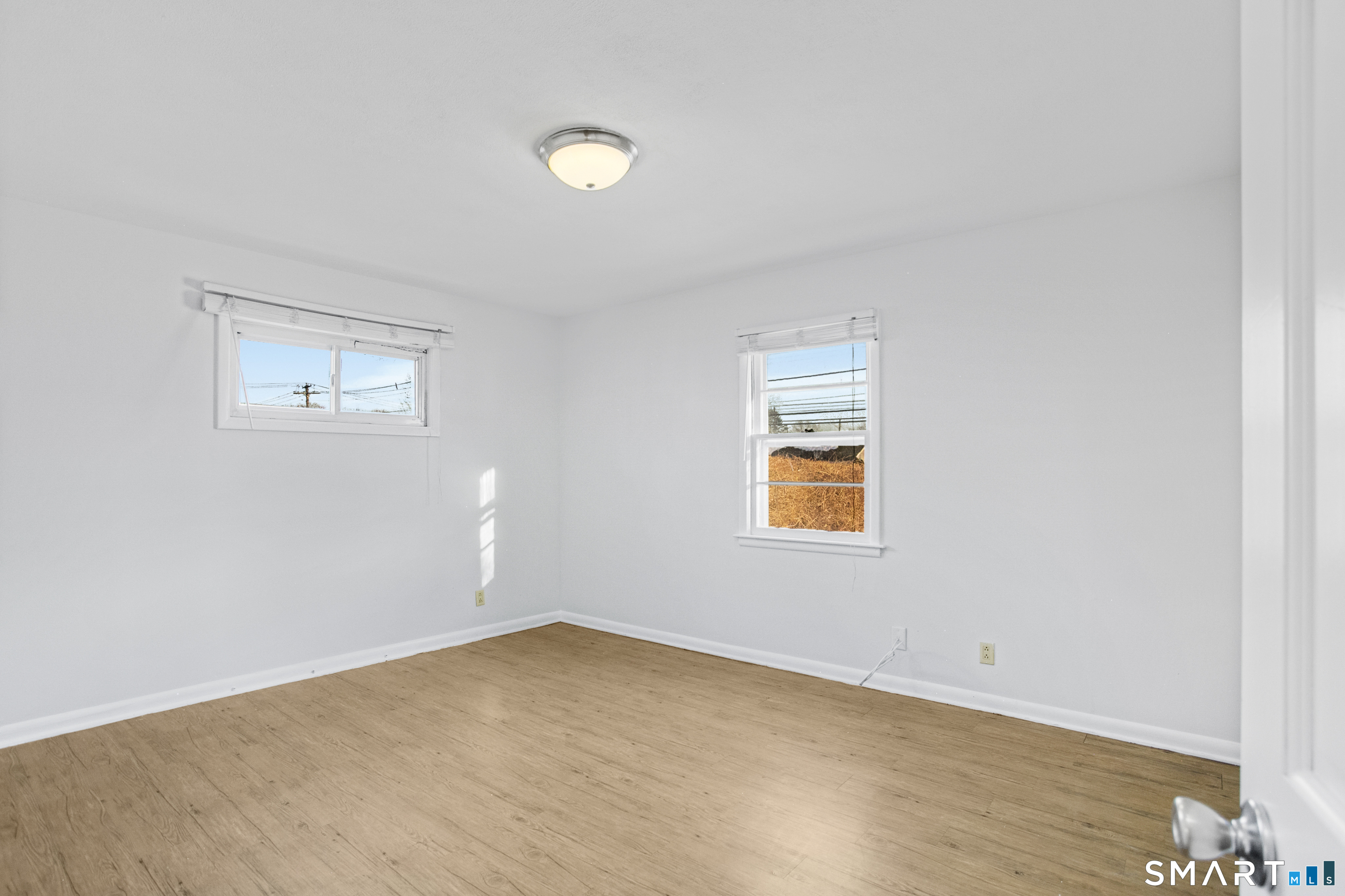 3432 Old Town Road Bridgeport, CT 06606 - Photo 17 of 27 an empty room with windows