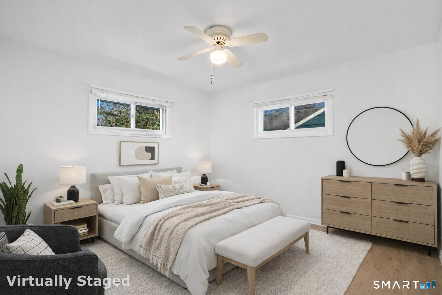 3432 Old Town Road Bridgeport, CT 06606 - Photo 18 of 27 a bedroom with a bed a mirror on dresser and a potted plant