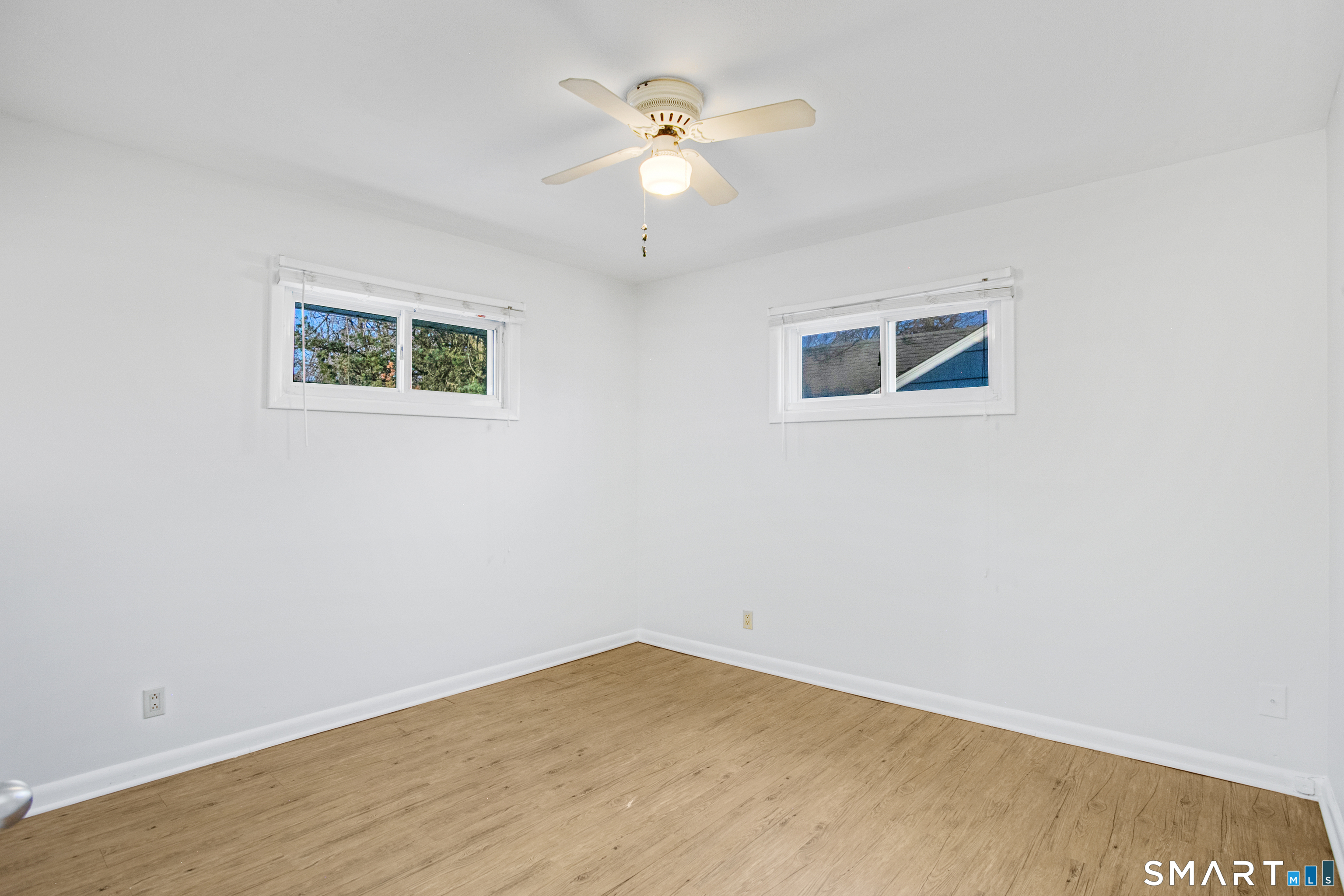 3432 Old Town Road Bridgeport, CT 06606 - Photo 19 of 27 an empty room with a ceiling fan and a window