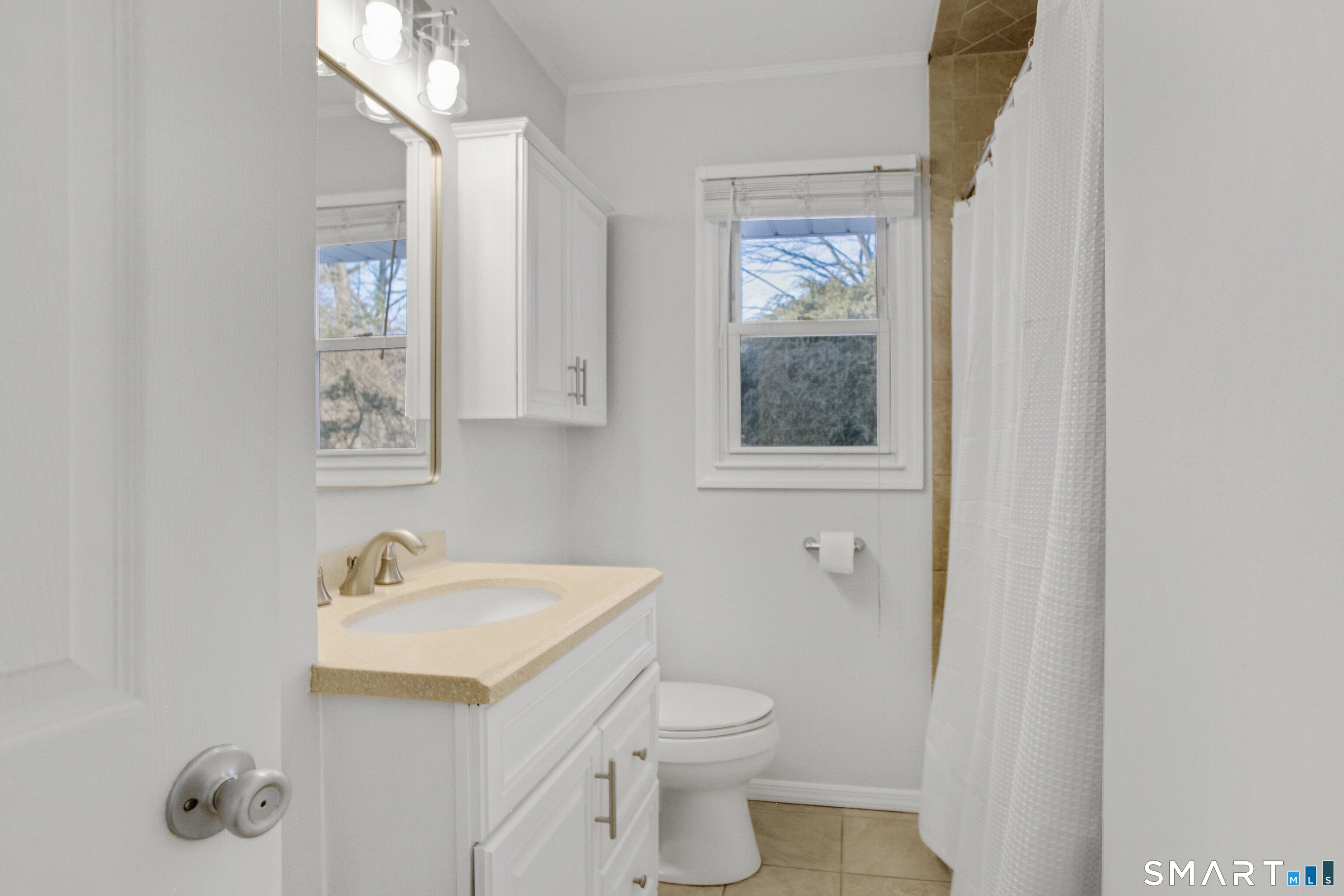 3432 Old Town Road Bridgeport, CT 06606 - Photo 20 of 27 a bathroom with a sink toilet and vanity