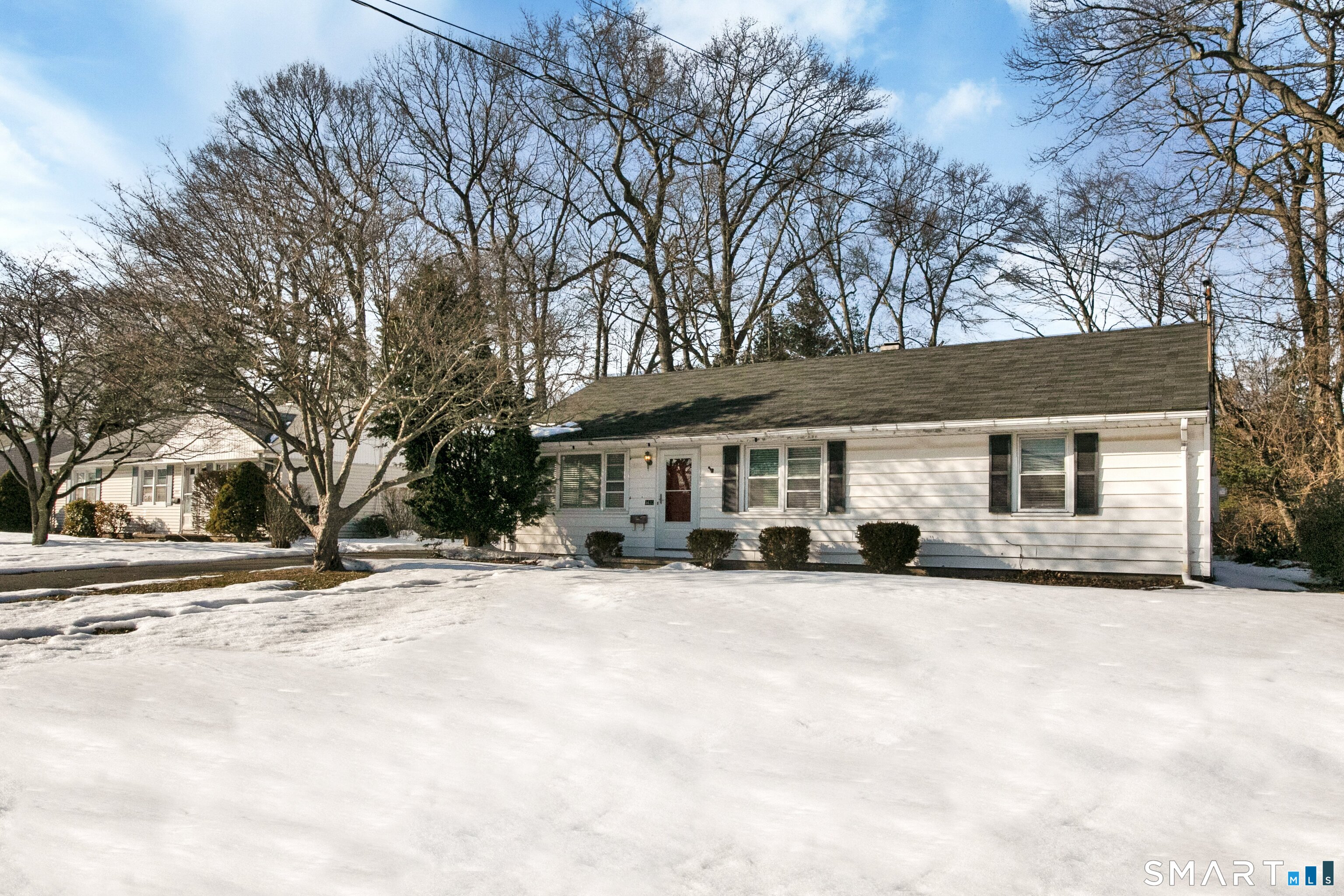 3432 Old Town Road Bridgeport, CT 06606 - Photo 2 of 27 a view of a house with a yard covered with snow in front of house