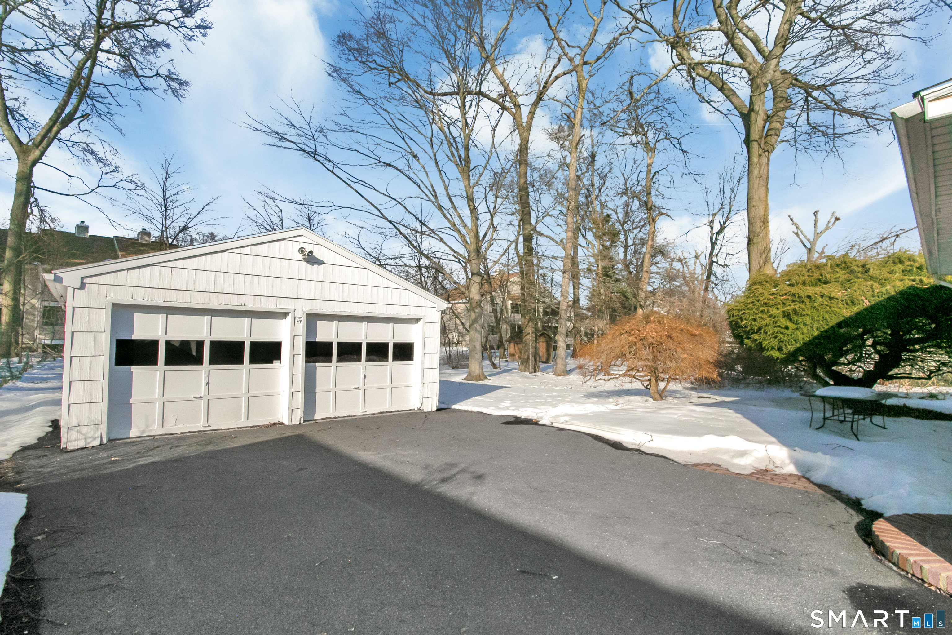 3432 Old Town Road Bridgeport, CT 06606 - Photo 22 of 27 a view of a house with a yard and potted plants
