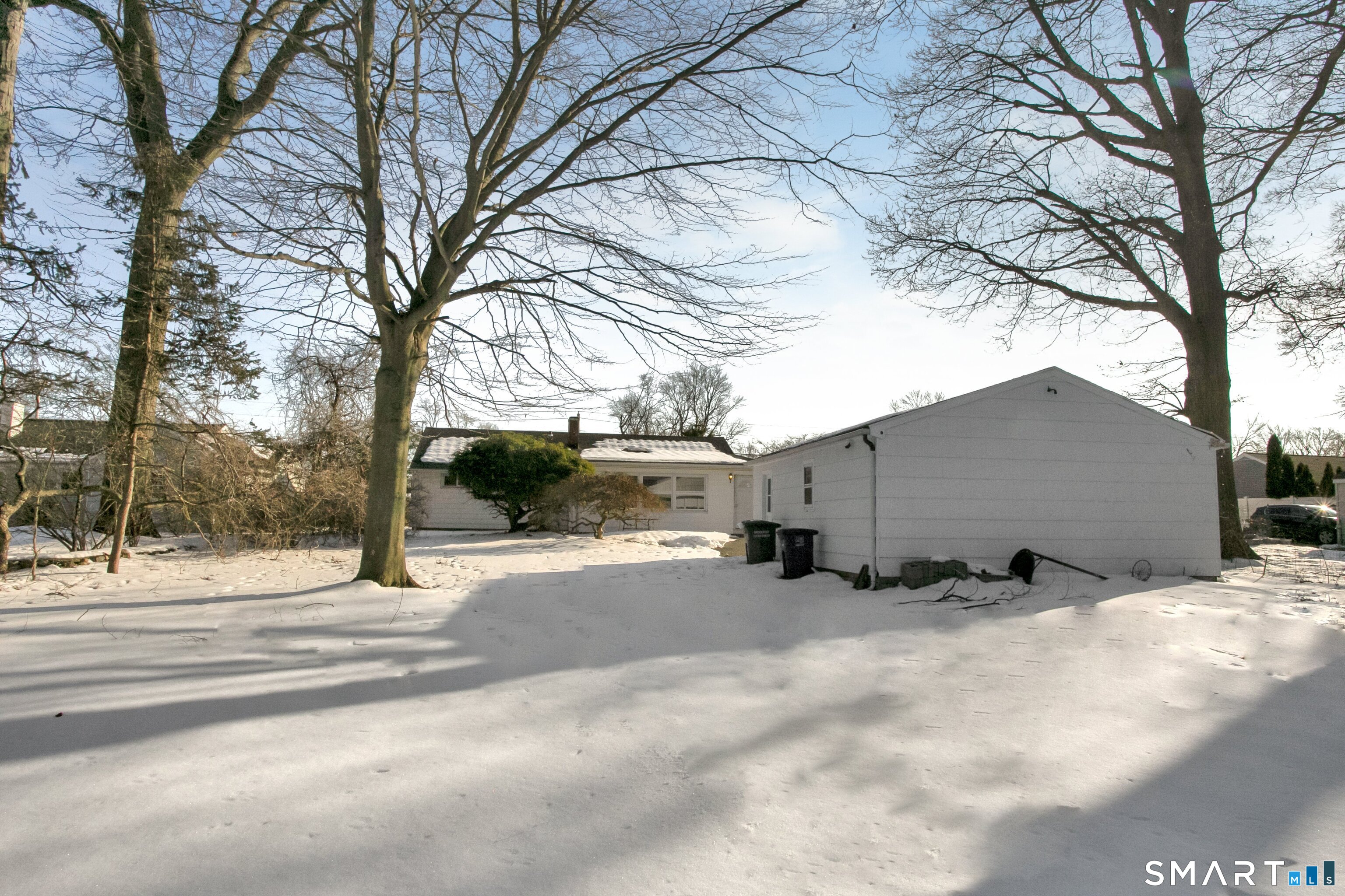 3432 Old Town Road Bridgeport, CT 06606 - Photo 23 of 27 a view of a house with a snow in the yard