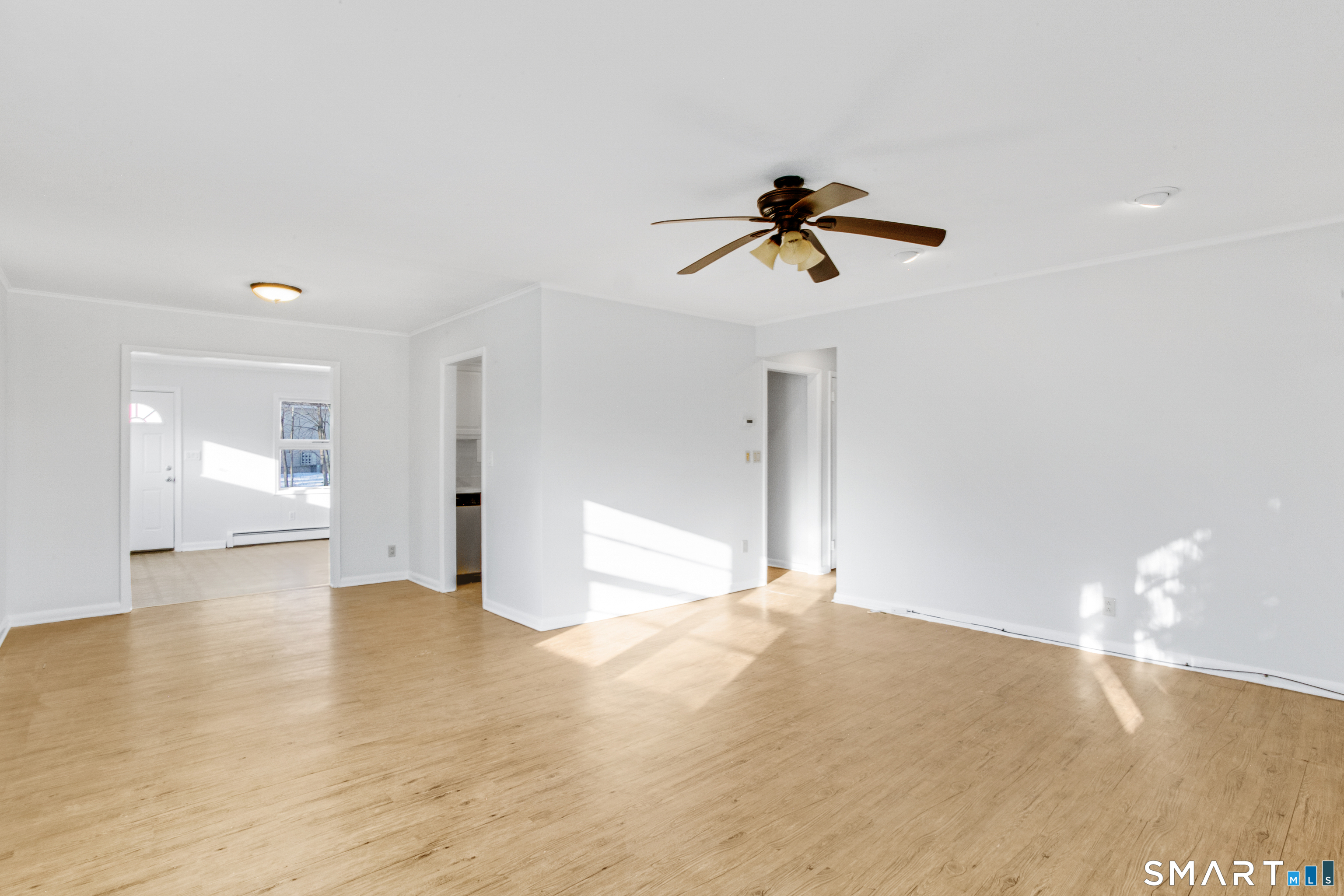3432 Old Town Road Bridgeport, CT 06606 - Photo 26 of 27 a view of a room with a window and wooden floor