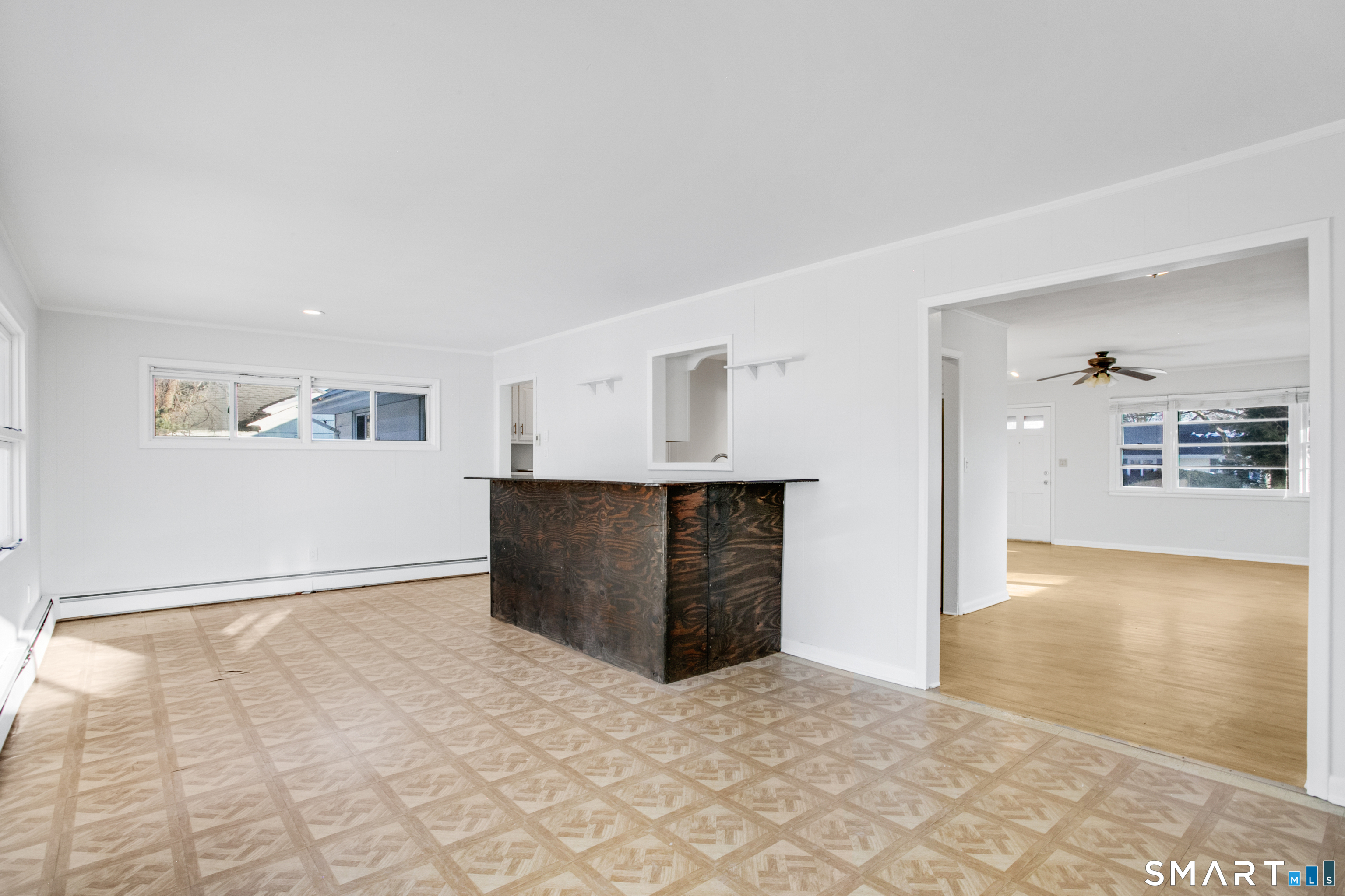 3432 Old Town Road Bridgeport, CT 06606 - Photo 8 of 27 a view of an empty room with kitchen and window
