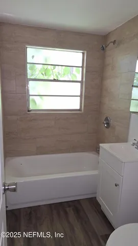 a bathroom with a toilet a sink and a bathtub