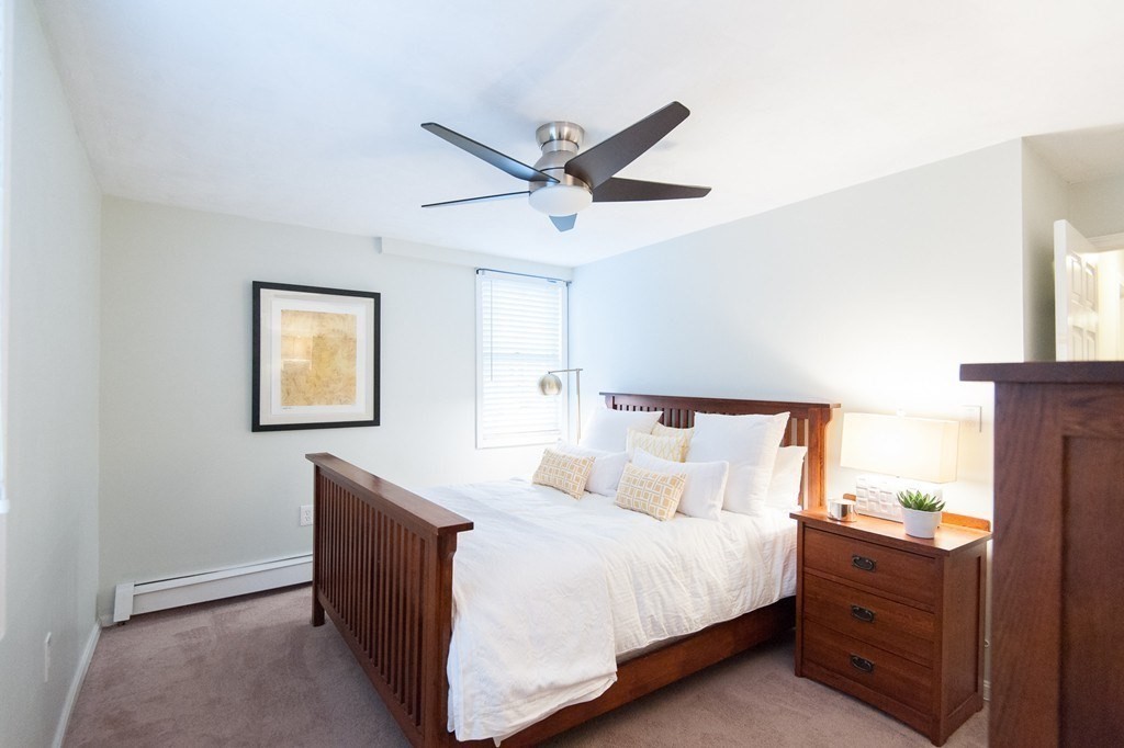 224 West Sixth Street, Unit 2 Boston, MA 02127 - Photo 13 of 18 a bedroom with a bed and a ceiling fan