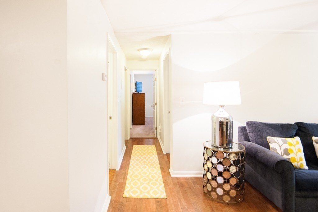 224 West Sixth Street, Unit 2 Boston, MA 02127 - Photo 16 of 18 a living room with furniture and a couch