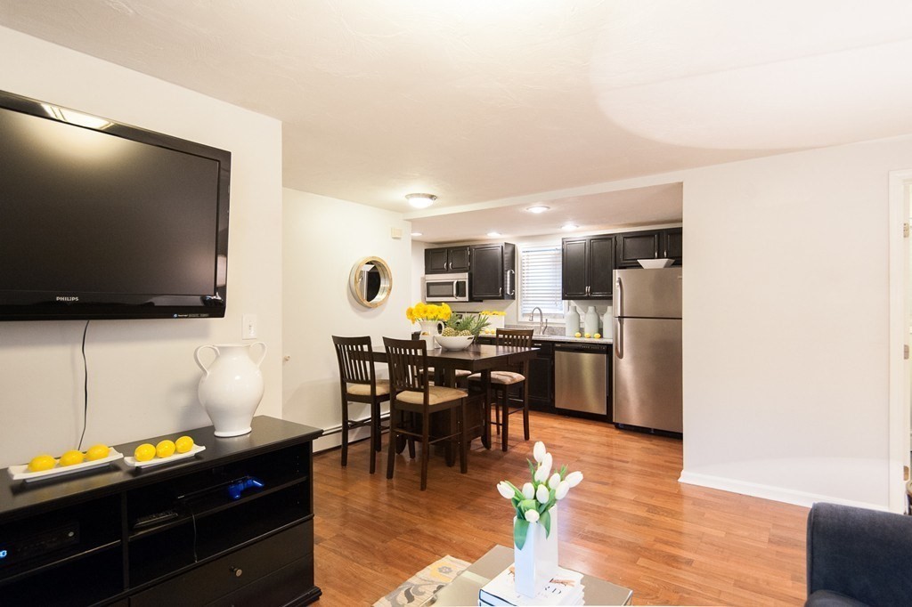 224 West Sixth Street, Unit 2 Boston, MA 02127 - Photo 6 of 18 a view of a dining room with furniture and wooden floor