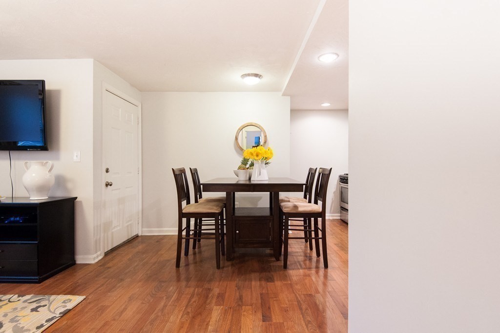 224 West Sixth Street, Unit 2 Boston, MA 02127 - Photo 10 of 18 a view of a dining room with furniture and wooden floor