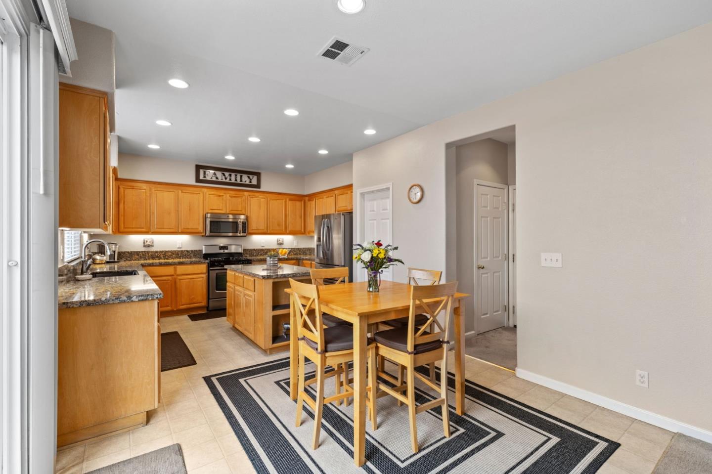 8975 Del Rio Circle Gilroy, CA 95020 - Photo 11 of 24 a view of a dining room with furniture