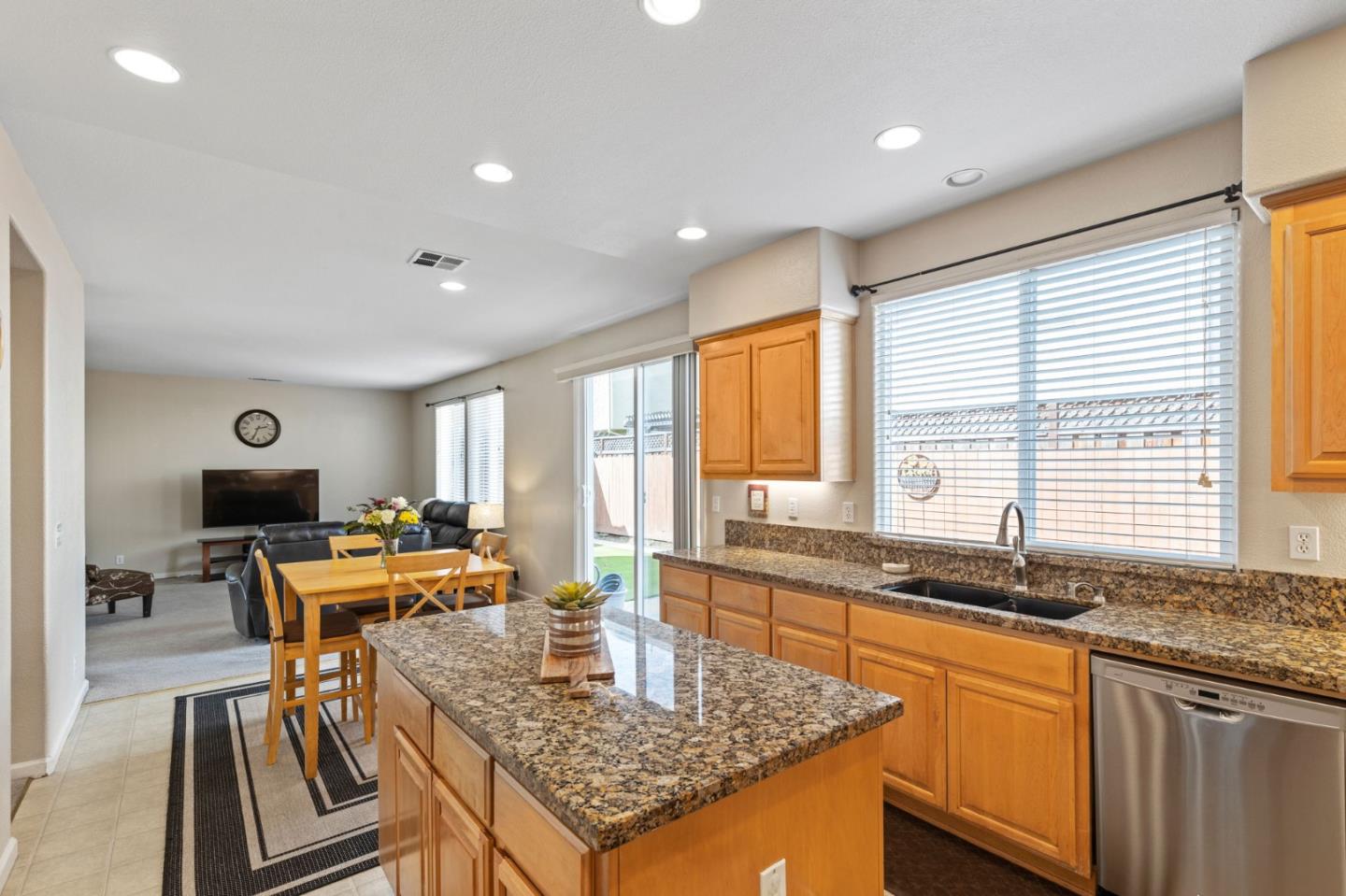 8975 Del Rio Circle Gilroy, CA 95020 - Photo 13 of 24 a kitchen with large windows and table