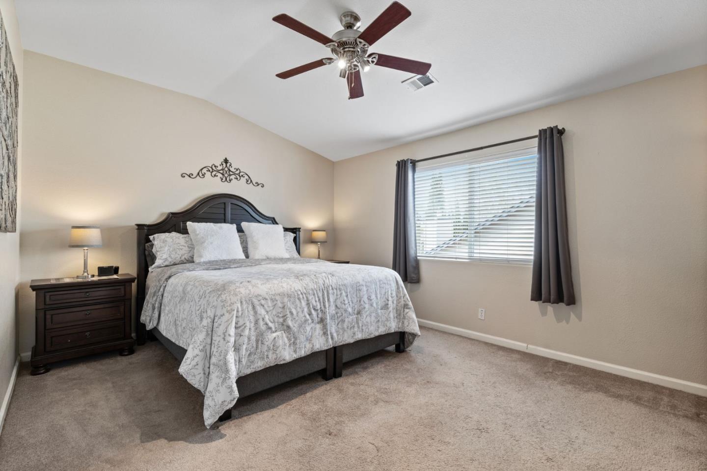 8975 Del Rio Circle Gilroy, CA 95020 - Photo 14 of 24 a bedroom with a bed and window