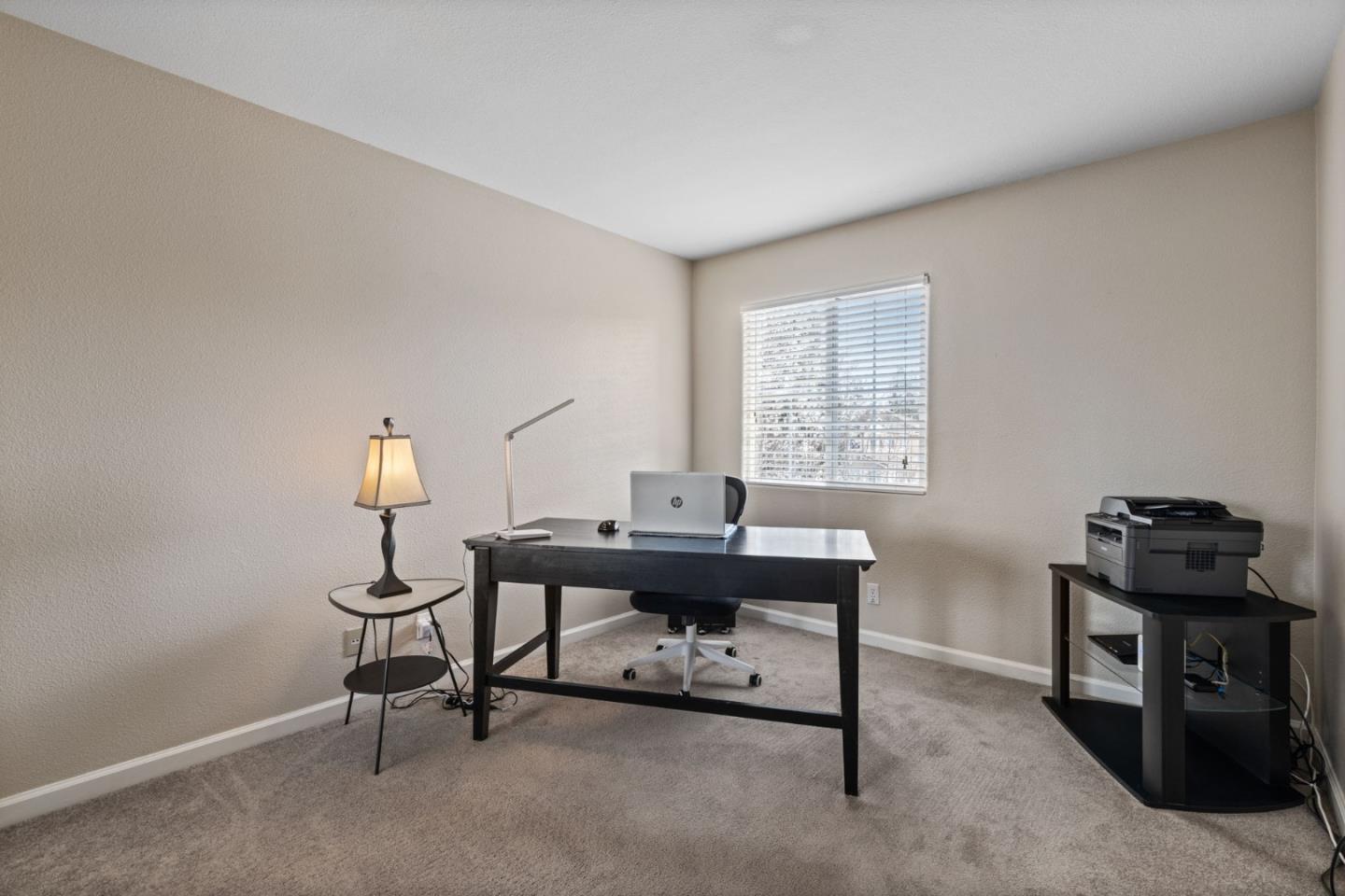 8975 Del Rio Circle Gilroy, CA 95020 - Photo 17 of 24 a view of a workspace with furniture and a window