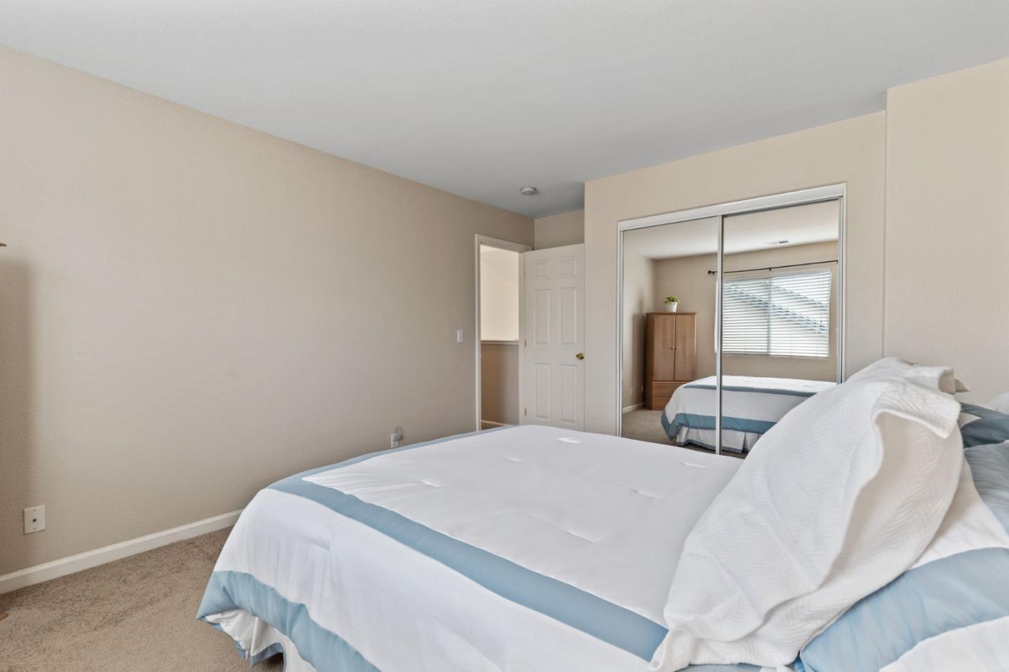 8975 Del Rio Circle Gilroy, CA 95020 - Photo 19 of 24 a bedroom with a bed and a window