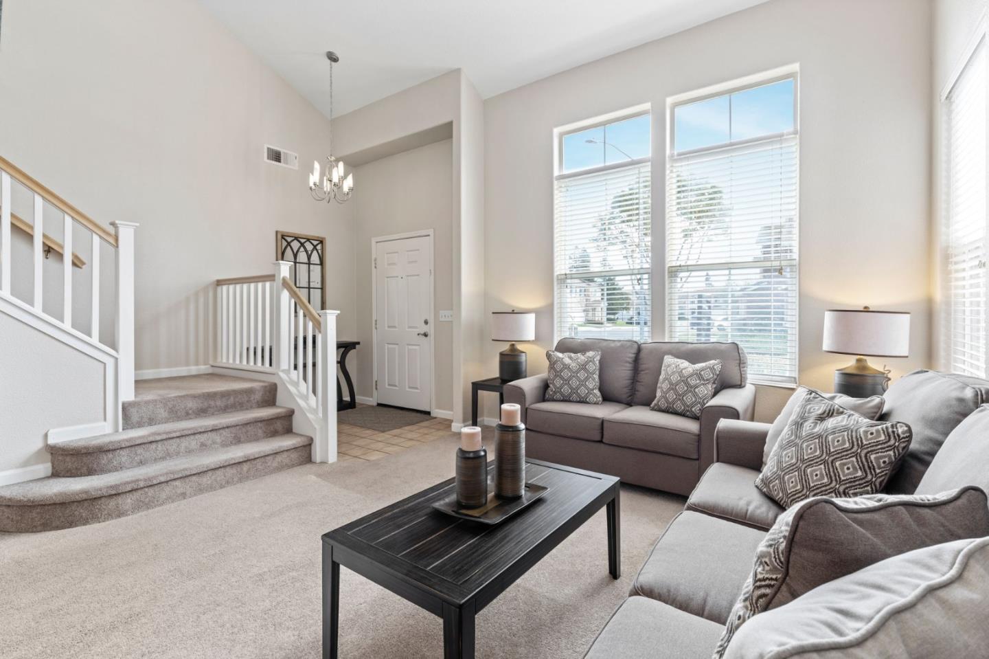 8975 Del Rio Circle Gilroy, CA 95020 - Photo 2 of 24 a living room with furniture and a floor to ceiling window