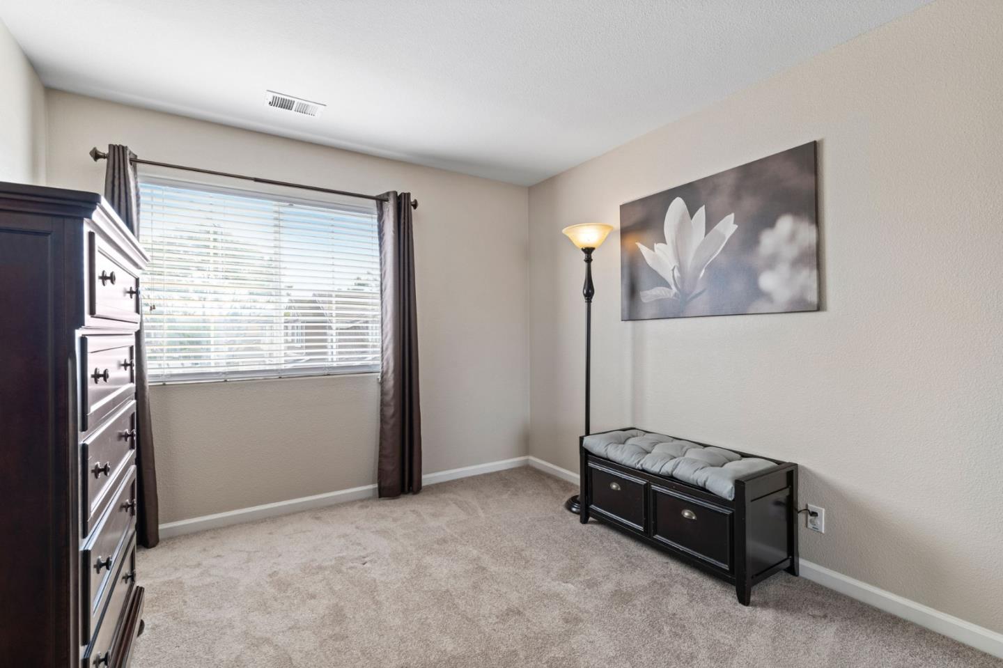 8975 Del Rio Circle Gilroy, CA 95020 - Photo 21 of 24 a living room with furniture and a window