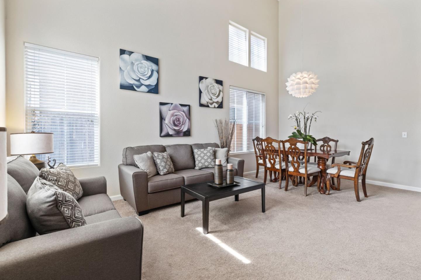 8975 Del Rio Circle Gilroy, CA 95020 - Photo 4 of 24 a living room with furniture and a large window