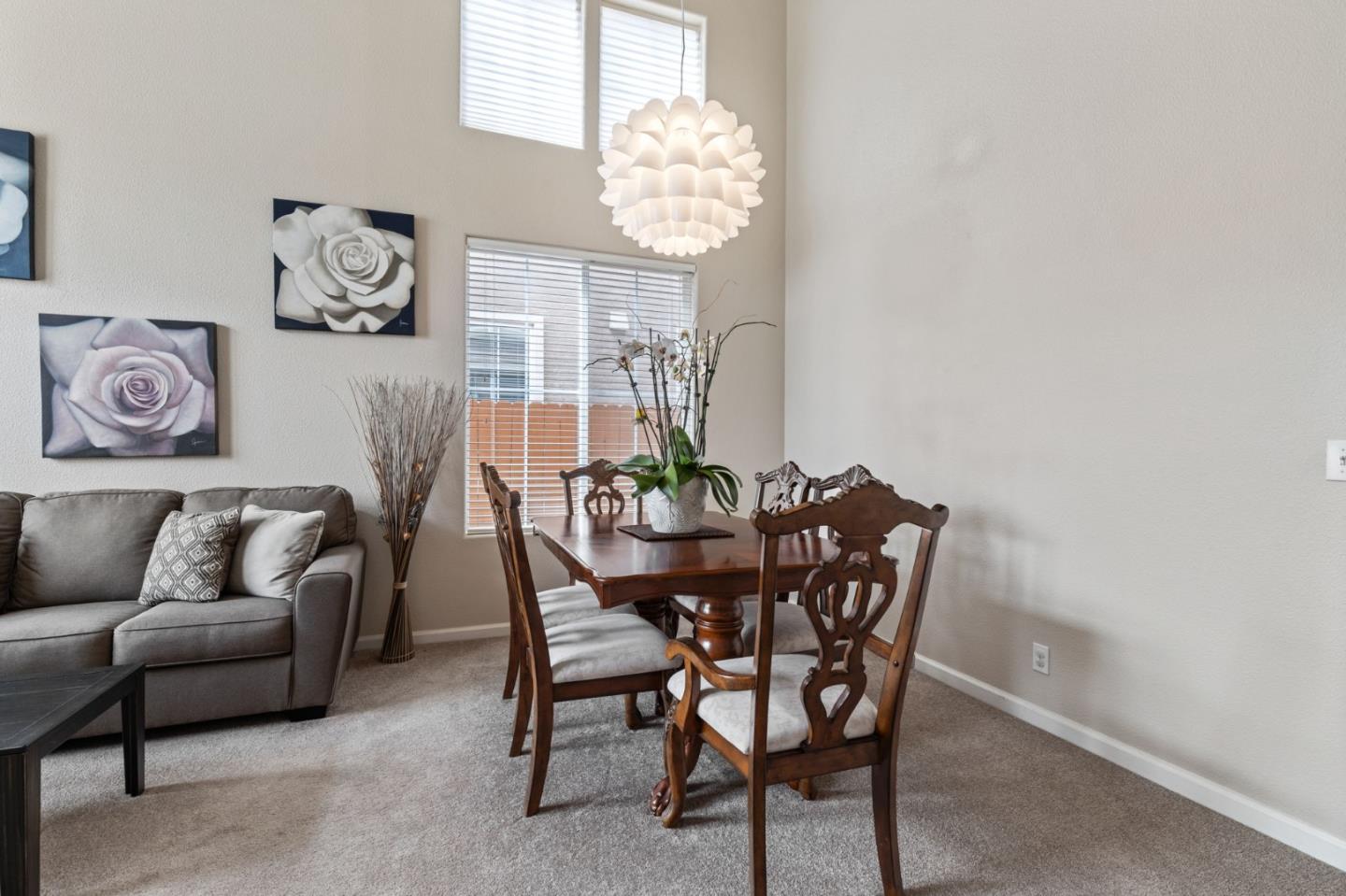 8975 Del Rio Circle Gilroy, CA 95020 - Photo 5 of 24 a view of a dining room with furniture and chandelier