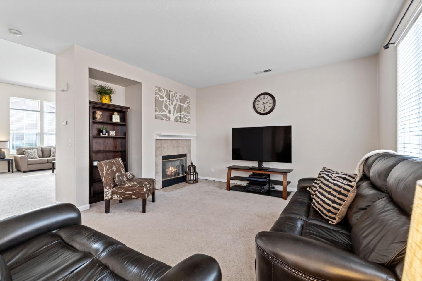 8975 Del Rio Circle Gilroy, CA 95020 - Photo 7 of 24 a living room with furniture ceiling fan and a window