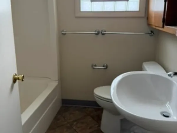a bathroom with a sink and mirror