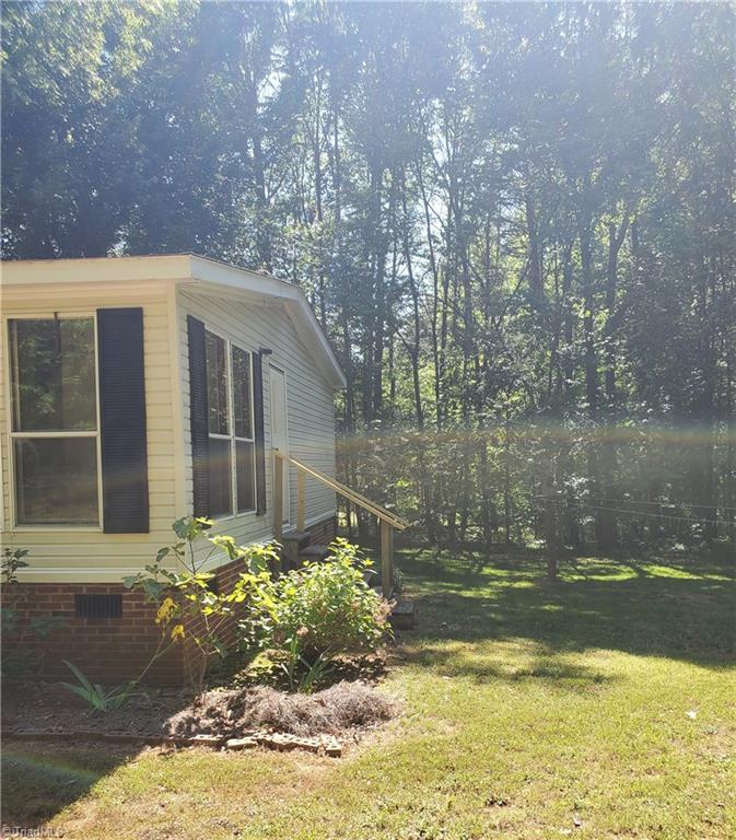502 Shaw Road Elon, NC 27244 - Photo 13 of 15 Right side of house - entrance into laundry room