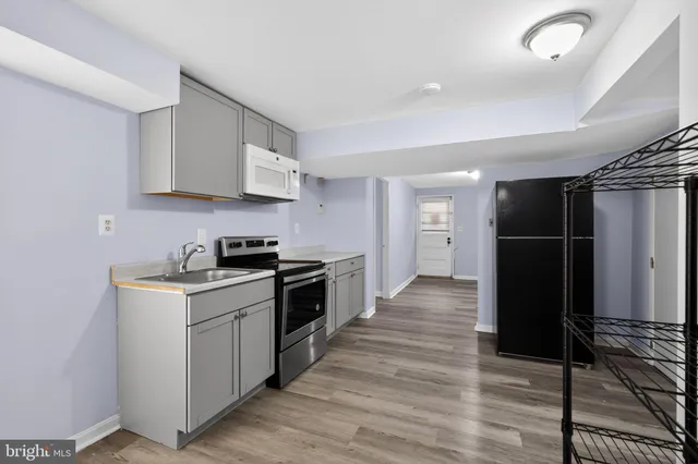a kitchen with stainless steel appliances granite countertop a stove and a refrigerator