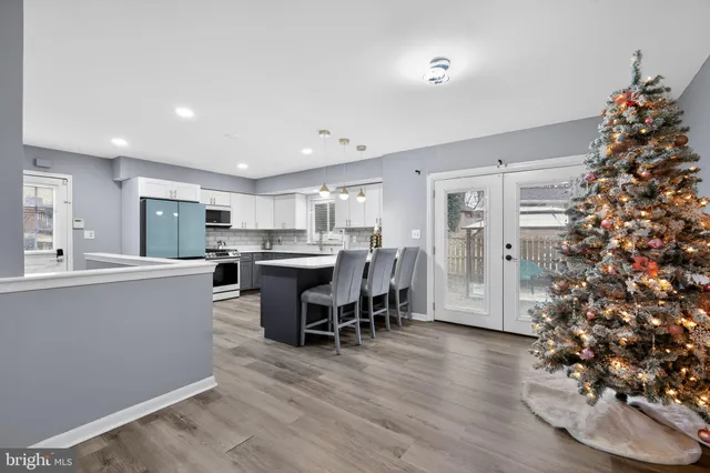 a kitchen with a table and chairs in it