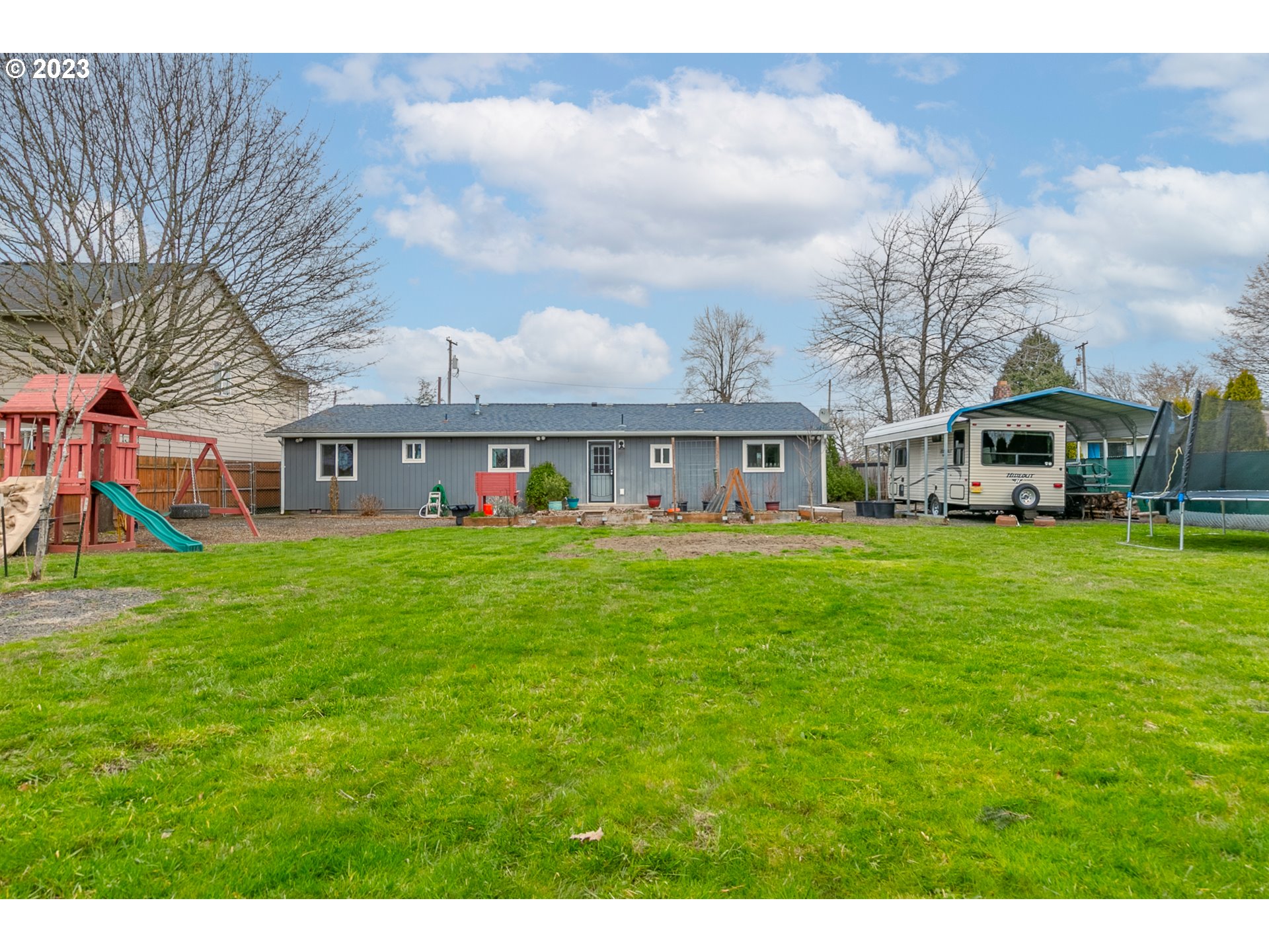 438 West Mary Street Lebanon, OR 97355 - Photo 2 of 33 a front view of house with yard