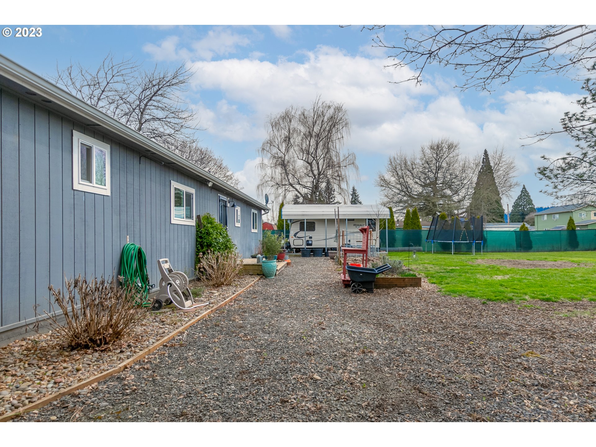 438 West Mary Street Lebanon, OR 97355 - Photo 21 of 33 a view of a house with a yard