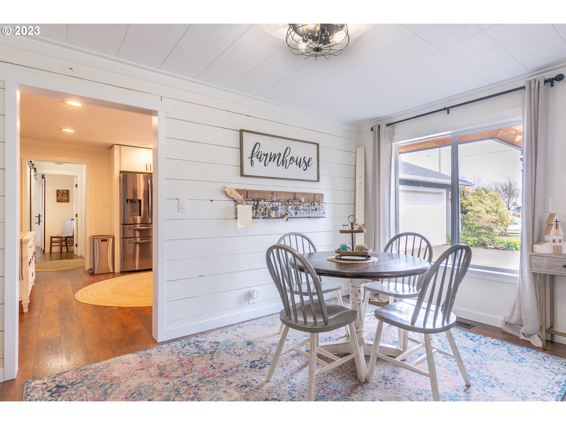 438 West Mary Street Lebanon, OR 97355 - Photo 5 of 33 a view of a dining room with furniture and a chandelier