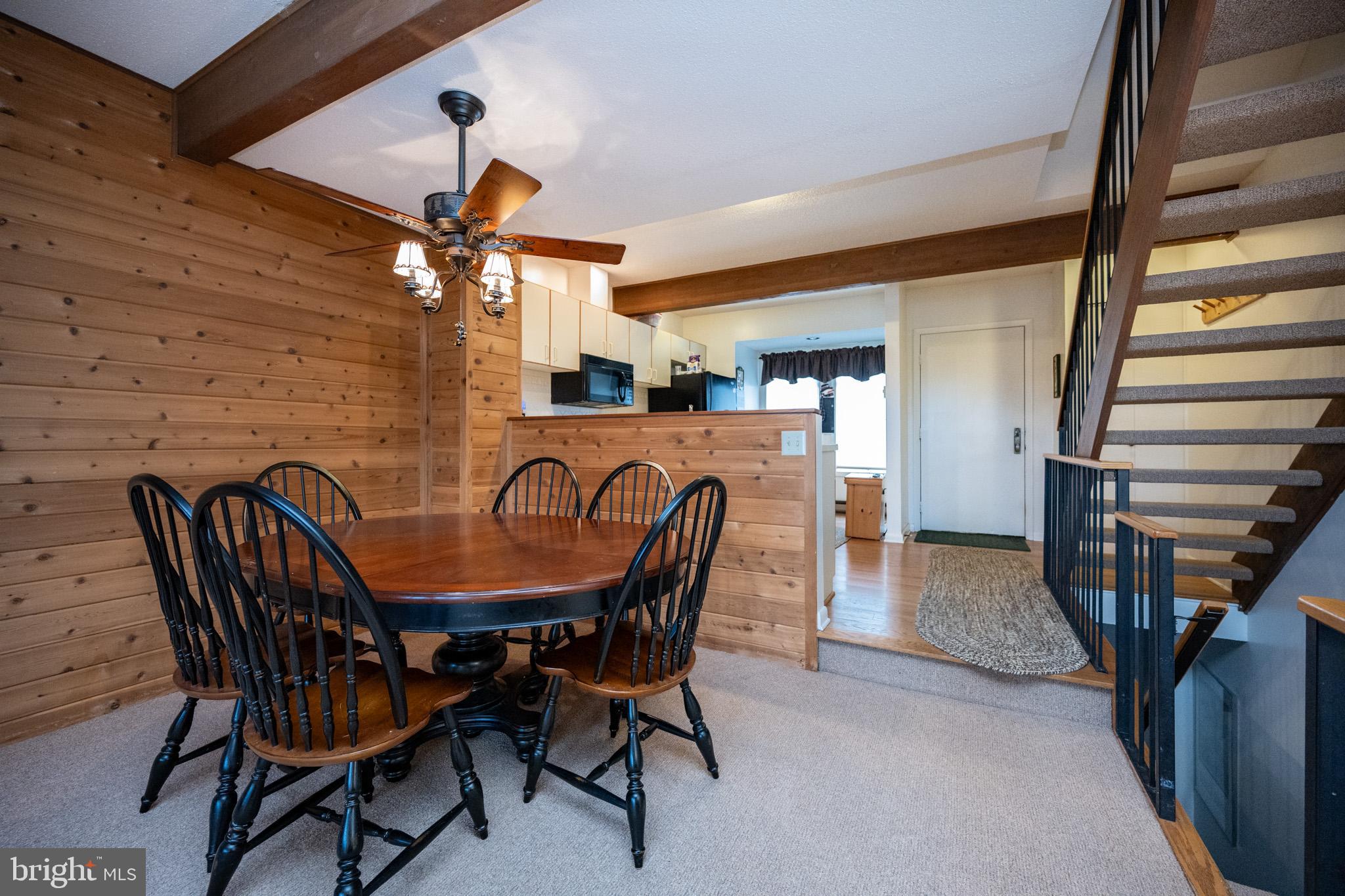 7 Winding Way, Unit 12B McHenry, MD 21541 - Photo 11 of 44 a view of a dining room with furniture and wooden floor