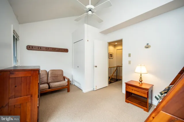 a bedroom with furniture and a chandelier