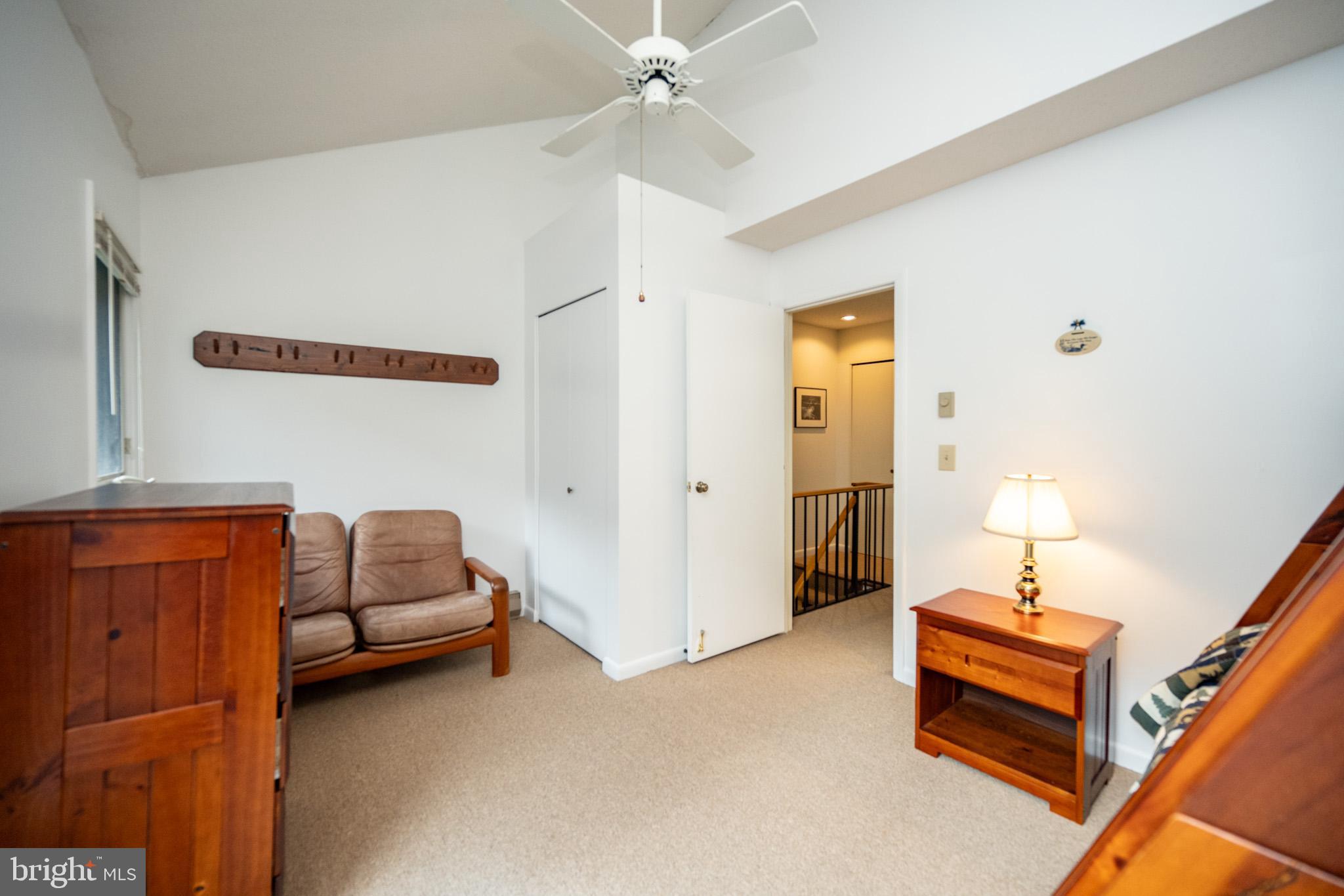 7 Winding Way, Unit 12B McHenry, MD 21541 - Photo 14 of 44 a bedroom with furniture and a chandelier