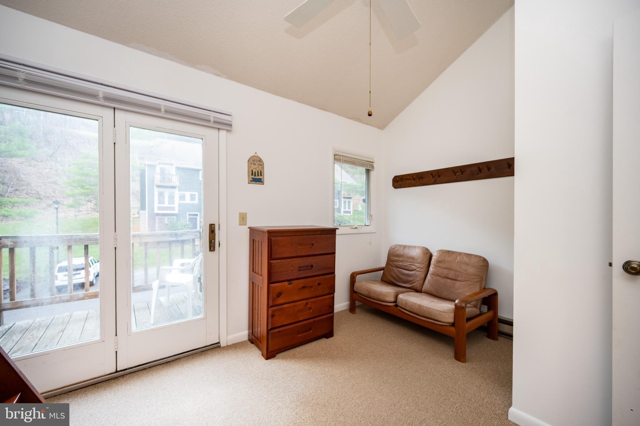 7 Winding Way, Unit 12B McHenry, MD 21541 - Photo 15 of 44 a living room with furniture and a window