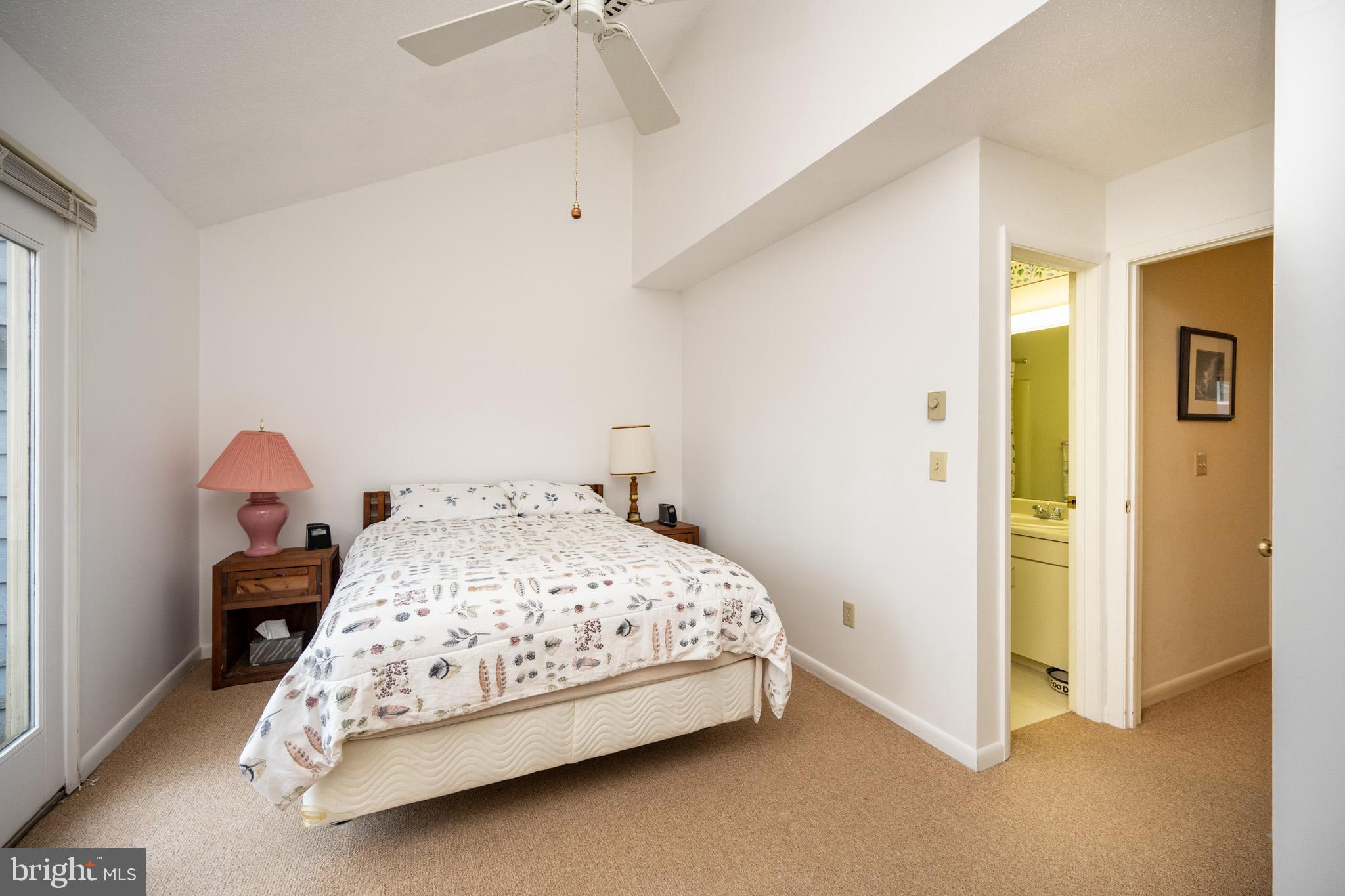 7 Winding Way, Unit 12B McHenry, MD 21541 - Photo 17 of 44 a bedroom with a bed and a chandelier