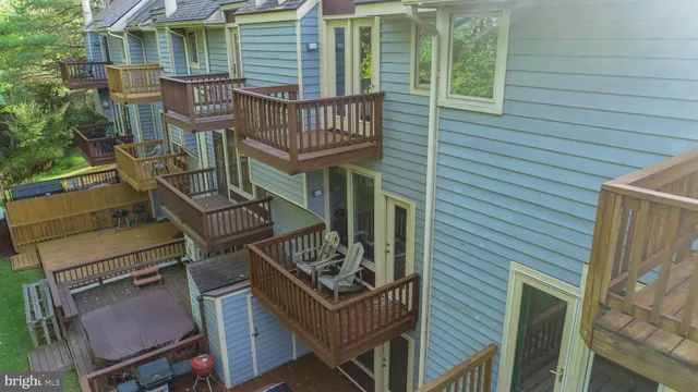 a balcony with table and chairs